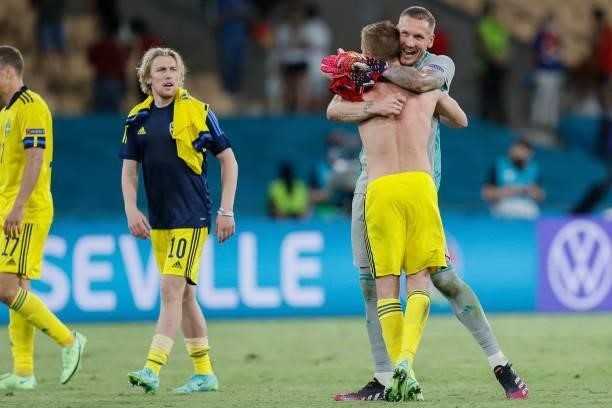 Sweden's goalkeeper Robin Olsen reacts with a teammate after the final whistle of the UEFA EURO 2020 Group E football match between Spain and Sweden...