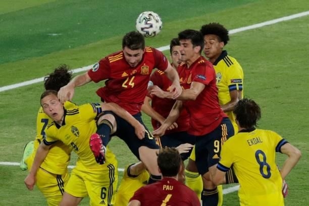 Players vie for the header during the UEFA EURO 2020 Group E football match between Spain and Sweden at La Cartuja Stadium in Sevilla on June 14,...