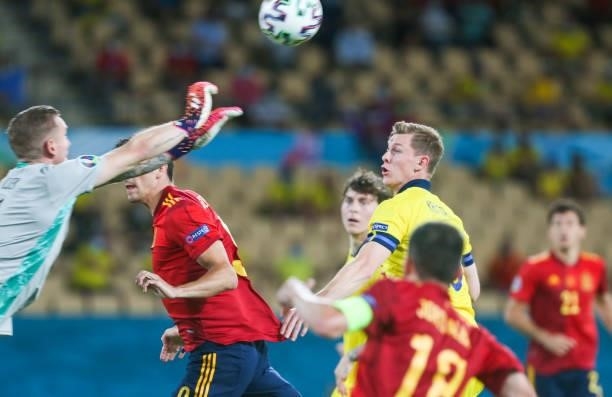 June 2021, Spain, Sevilla: Football: European Championship Group E, Spain - Sweden: Sweden's goalkeeper Robin Olsen clears from Sweden's Emil Krafth...