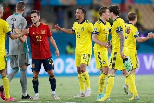 Spain's midfielder Pablo Sarabia and Sweden's midfielder Robin Quaison react after the final whistle of the UEFA EURO 2020 Group E football match...