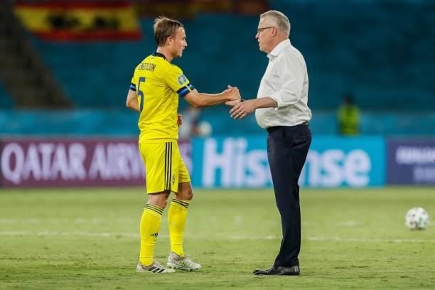 Sweden's defender Pierre Bengtsson reacts with Sweden's coach Jan Andersson after the final whistle of the UEFA EURO 2020 Group E football match...