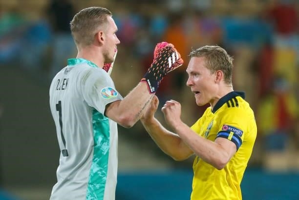 June 2021, Spain, Sevilla: Football: European Championship Group E, Spain - Sweden: Sweden's goalkeeper Robin Olsen and Ludwig Augustinsson....