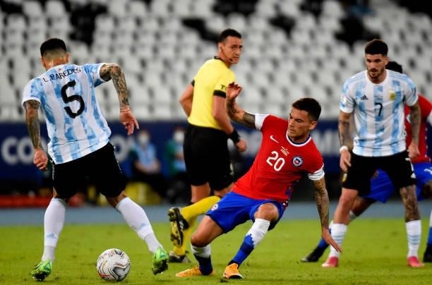 Charles Aranguiz of Chile competes for the ball with Leandro Paredes of Argentina ,during the match between Argentina and Chile as part of Conmebol...