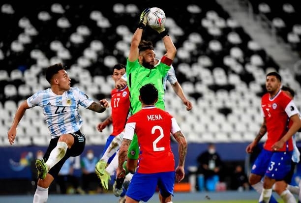 Claudio Bravo of Chile competes against Nicolas Tagliafico and Lautaro Martinez of Argentina ,during the match between Argentina and Chile as part of...