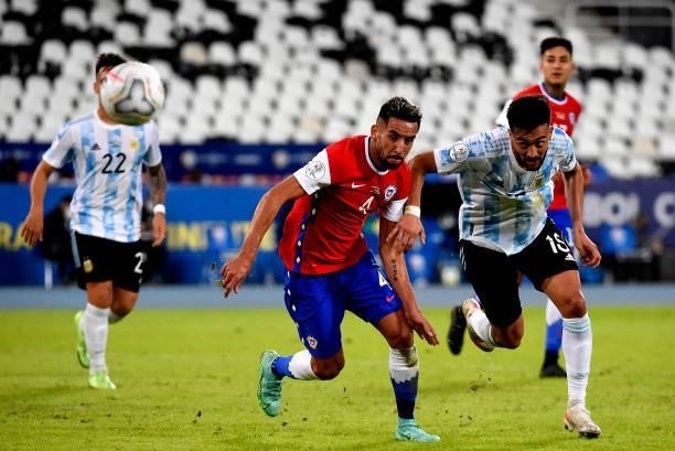 Nicolas Gonzalez of Argentina competes for the ball with Mauricio Isla of Chile ,during the match between Argentina and Chile as part of Conmebol...