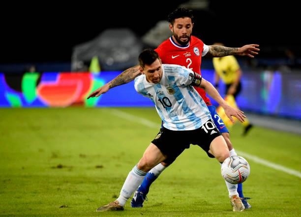 Lionel Messi of Argentina competes for the ball with Eugenio Mena of Chile ,during the match between Argentina and Chile as part of Conmebol Copa...