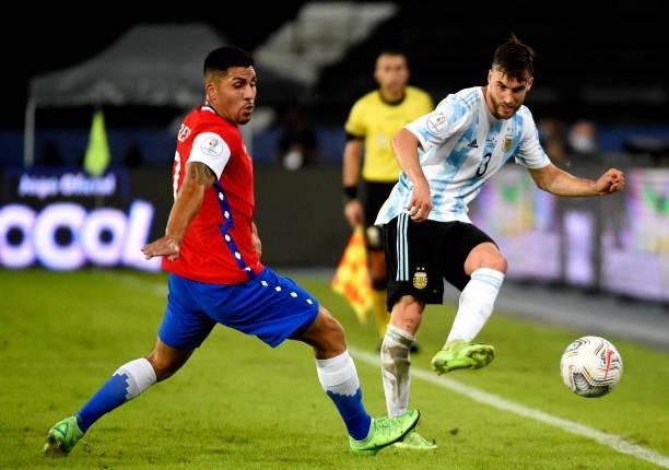 Nicolas Tagliafico of Argentina competes for the ball with Jean Meneses of Chile ,during the match between Argentina and Chile as part of Conmebol...