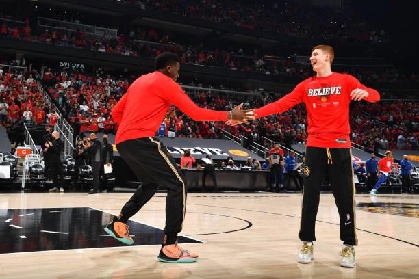 Clint Capela of the Atlanta Hawks and Kevin Huerter of the Atlanta Hawks high-five prior to a game against the Philadelphia 76ers during Round 2,...