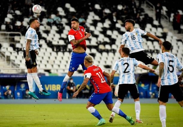 Guillermo Maripan of Chile heads the ball against Nicolas Otamendi of Argentina during the match between Argentina and Chile as part of Conmebol Copa...
