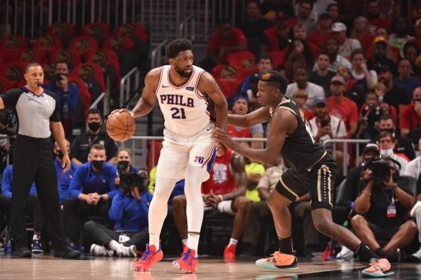 Joel Embiid of the Philadelphia 76ers handles the ball against Clint Capela of the Atlanta Hawks during Round 2, Game 4 of the Eastern Conference...