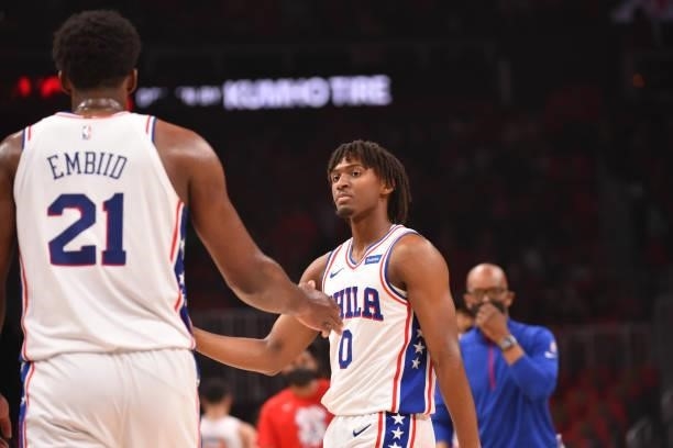 Joel Embiid of the Philadelphia 76ers and Tyrese Maxey of the Philadelphia 76ers high-five during a game against the Atlanta Hawks during Round 2,...