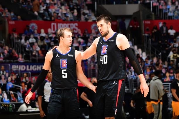 Luke Kennard talks with Ivica Zubac of the LA Clippers during Round 2, Game 4 of 2021 NBA Playoffs on June 14, 2021 at STAPLES Center in Los Angeles,...