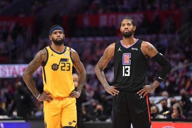 Royce O'Neale of the Utah Jazz and Paul George of the LA Clippers look on during Round 2, Game 4 of the 2021 NBA Playoffs on June 14, 2021 at STAPLES...