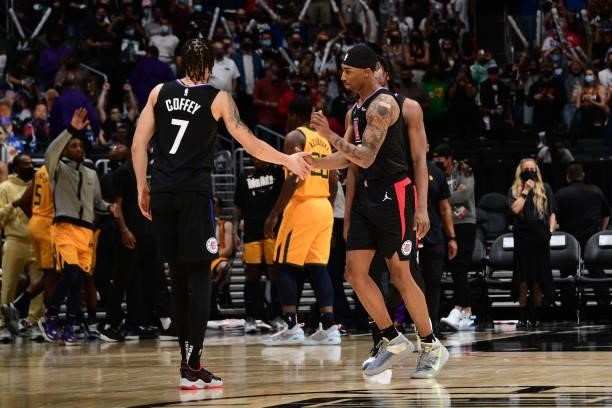 Jay Scrubb of the LA Clippers hi-fives Amir Coffey during Round 2, Game 4 of 2021 NBA Playoffs on June 14, 2021 at STAPLES Center in Los Angeles,...