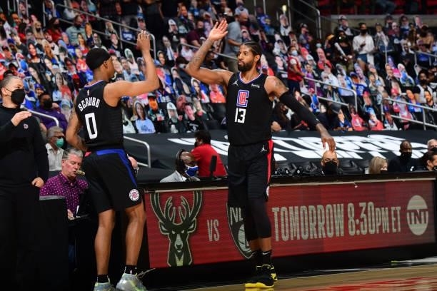 Paul George of the LA Clippers hi-fives Jay Scrubb during Round 2, Game 4 of 2021 NBA Playoffs on June 14, 2021 at STAPLES Center in Los Angeles,...