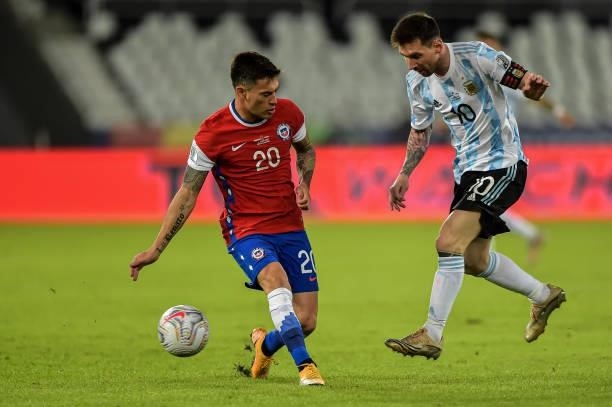 Messi player from Argentina disputes a bid with Aranguiz player from Chile during a match at the Engenhão stadium for the Copa América 2021, on June...