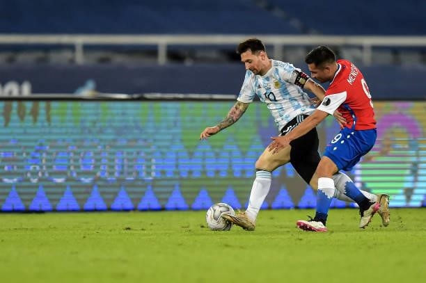 Messi player from Argentina disputes a bid with Meneses player from Chile during a match at the Engenhão stadium for the Copa América 2021, on June...
