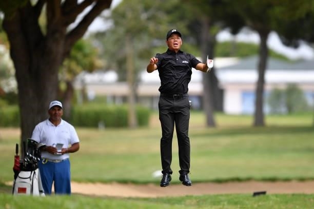 Ashun Wu of China jumps before playing his second shoot on the first hole during Day One of the Challenge de Espana at Iberostar Real Club de Golf...