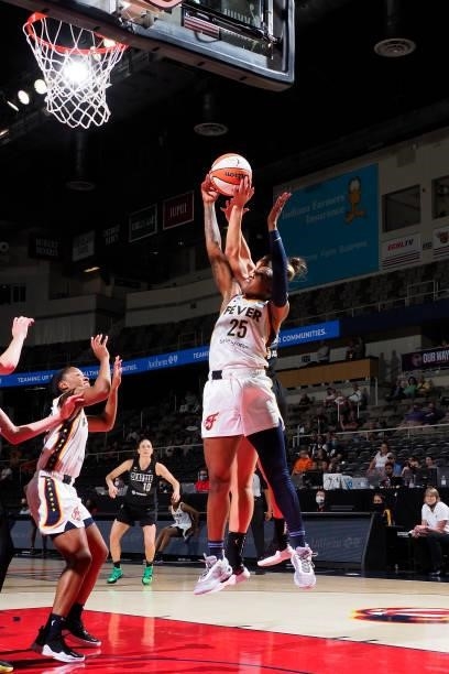 Tiffany Mitchell of the Indiana Fever grabs the rebound against the Seattle Storm on June 15, 2021 at Bankers Life Fieldhouse in Indianapolis,...