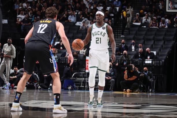 Jrue Holiday of the Milwaukee Bucks handles the ball against the Brooklyn Nets during Round 2, Game 5 of the 2021 NBA Playoffs on June 15, 2021 at...