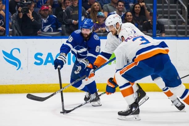 Nikita Kucherov of the Tampa Bay Lightning skates against Ryan Pulock and Adam Pelech of the New York Islanders during the first period in Game Two...