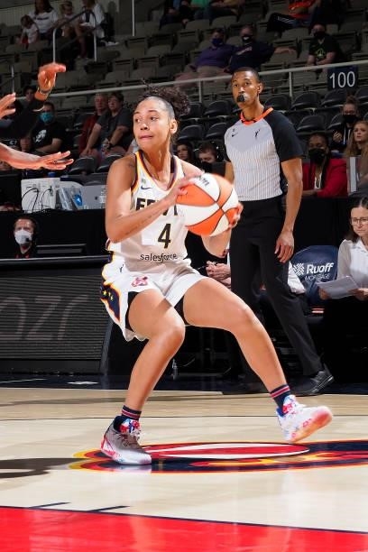 Kysre Gondrezick of the Indiana Fever looks to pass the ball against the Seattle Storm on June 15, 2021 at Bankers Life Fieldhouse in Indianapolis,...