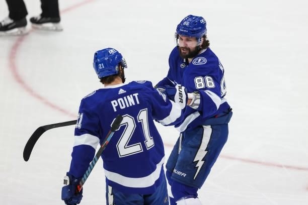 Brayden Point and Nikita Kucherov of the Tampa Bay Lightning celebrate a goal against the New York Islanders during the first period in Game Two of...