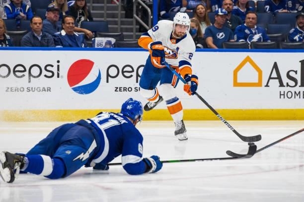 Erik Cernak of the Tampa Bay Lightning slides to block a pass by Brock Nelson of the New York Islanders during the second period in Game Two of the...