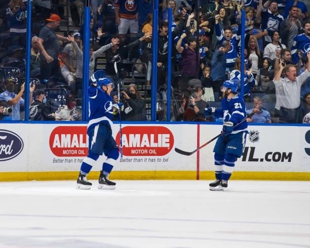 Ondrej Palat of the Tampa Bay Lightning celebrates a goal with teammate Brayden Point against the New York Islanders during the second period in Game...