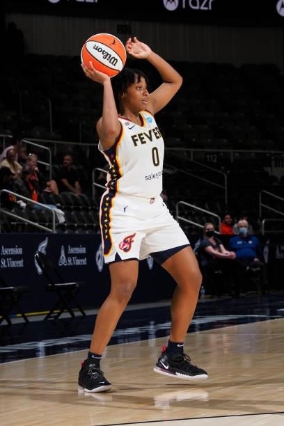 Kelsey Mitchell of the Indiana Fever looks to pass the ball against the Seattle Storm on June 15, 2021 at Bankers Life Fieldhouse in Indianapolis,...
