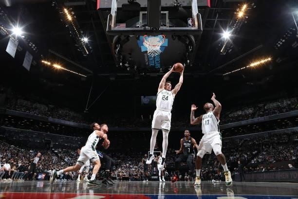 Pat Connaughton of the Milwaukee Bucks rebounds the ball against the Brooklyn Nets during Round 2, Game 5 of the 2021 NBA Playoffs on June 15, 2021...