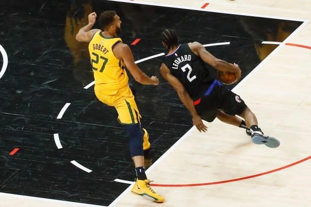 Kawhi Leonard of the LA Clippers drives to the basket against Rudy Gobert of the Utah Jazz during Round 2, Game 4 of 2021 NBA Playoffs on June 14,...