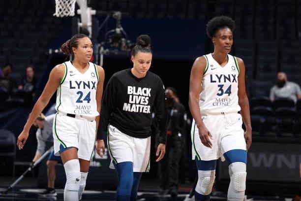 Napheesa Collier, Kayla McBride, and Sylvia Fowles of the Minnesota Lynx looks on during the game against the Chicago Sky on June 15, 2021 at Target...