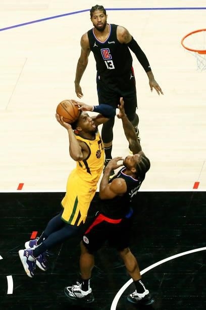 Donovan Mitchell of the Utah Jazz shoots the ball against Kawhi Leonard of the LA Clippers during Round 2, Game 4 of 2021 NBA Playoffs on June 14,...