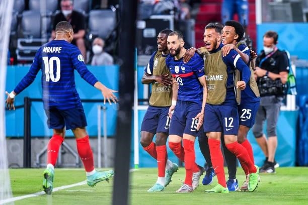 Karim BENZEMA of France celebrates his goal with Kylian MBAPPE of France and team mates during the UEFA European Championship football match between...