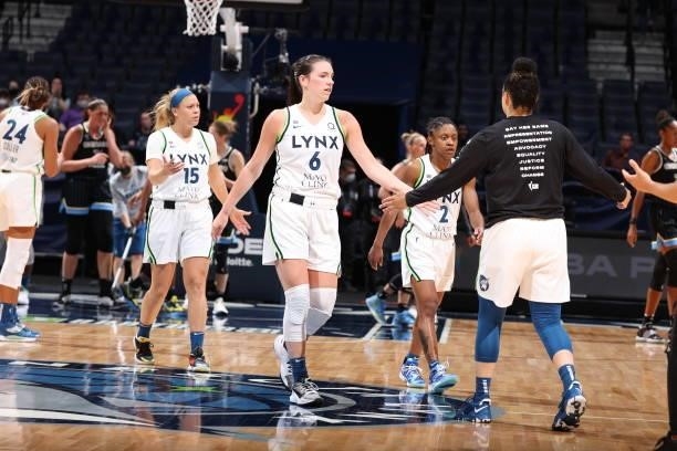 Bridget Carleton of the Minnesota Lynx hi-fives her teammates during the game against the Chicago Sky on June 15, 2021 at Target Center in...