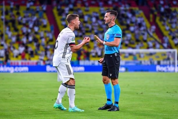 Joshua KIMMICH of Germany argues with the referee during the UEFA European Championship football match between France and Allemagne at Allianz Arena...
