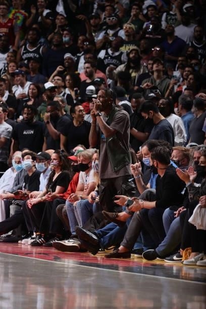 Rapper, Travis Scott cheers during Round 2, Game 5 of the 2021 NBA Playoffs on June 15, 2021 at Barclays Center in Brooklyn, New York. NOTE TO USER:...
