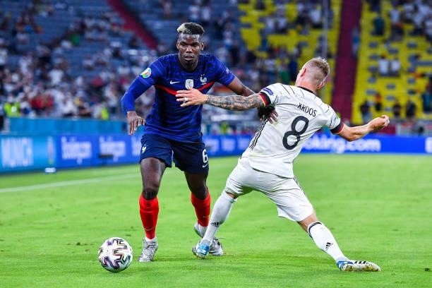 Paul POGBA of France and Toni KROOS of Germany during the UEFA European Championship football match between France and Allemagne at Allianz Arena on...