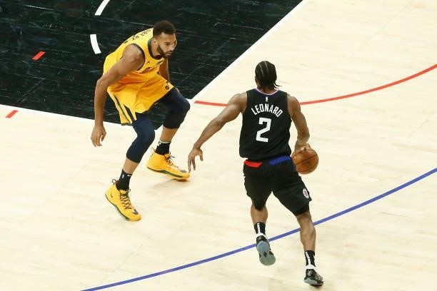 Kawhi Leonard of the LA Clippers handles the ball against Rudy Gobert of the Utah Jazz during Round 2, Game 4 of 2021 NBA Playoffs on June 14, 2021...