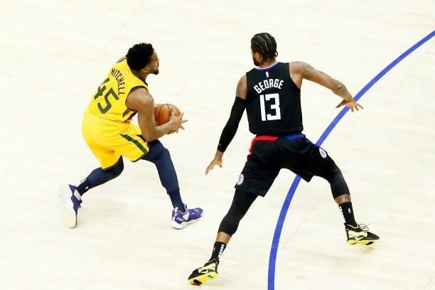 Donovan Mitchell of the Utah Jazz handles the ball against Paul George of the LA Clippers during Round 2, Game 4 of 2021 NBA Playoffs on June 14,...