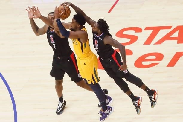 Donovan Mitchell of the Utah Jazz shoots the ball against Patrick Beverley of the LA Clippers during Round 2, Game 4 of 2021 NBA Playoffs on June 14,...