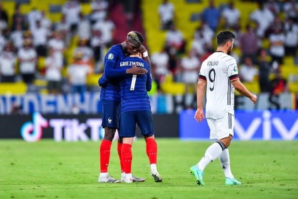 Antoine GRIEZMANN of France celebrates with Paul POGBA of France in front of Kevin VOLLAND of Germany during the UEFA European Championship football...
