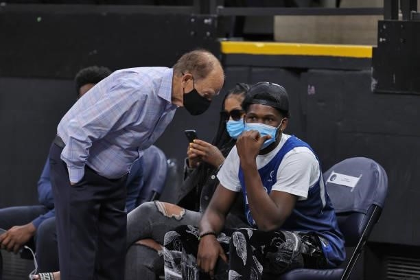Anthony Edwards of the Minnesota Timberwolves talks with Minnesota Lynx and Timberwolves owner, Glen Taylor, during the Chicago Sky vs. Minnesota...