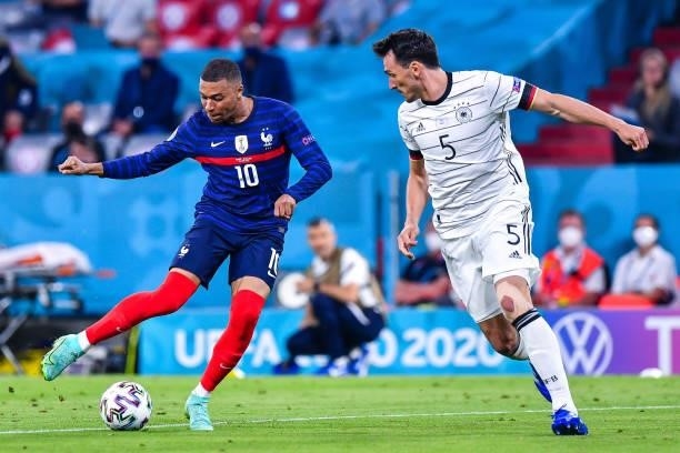Kylian MBAPPE of France and Mats HUMMELS of Germany during the UEFA European Championship football match between France and Allemagne at Allianz...