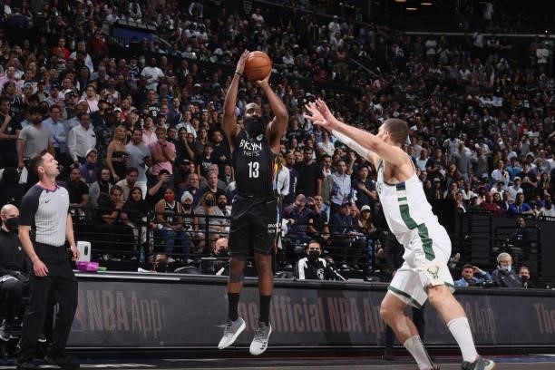 James Harden of the Brooklyn Nets shoots a three point basket against the Milwaukee Bucks during Round 2, Game 5 of the 2021 NBA Playoffs on June 15,...