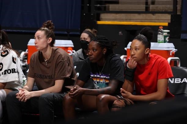 Jessica Shepard, Rennia Davis, and Aerial Powers of the Minnesota Lynx looks on during the game against the Chicago Sky on June 15, 2021 at Target...