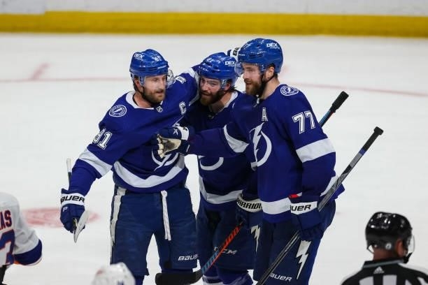 Victor Hedman of the Tampa Bay Lightning celebrates a goal with teammates Steven Stamkos and Brayden Point against the New York Islanders during the...