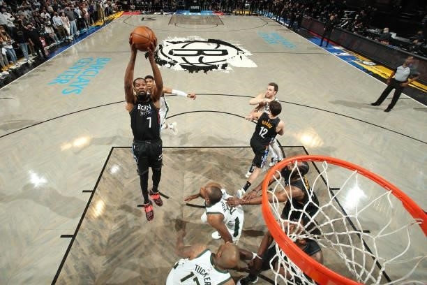 Kevin Durant of the Brooklyn Nets rebounds the ball against the Milwaukee Bucks during Round 2, Game 5 of the 2021 NBA Playoffs on June 15, 2021 at...
