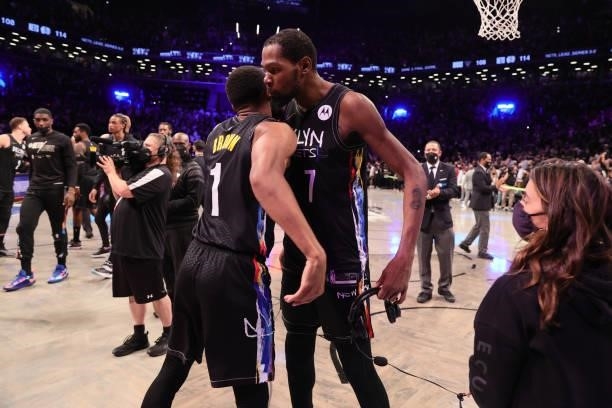 Kevin Durant of the Brooklyn Nets hugs Bruce Brown of the Brooklyn Nets after the game against the Milwaukee Bucks during Round 2, Game 5 of the 2021...